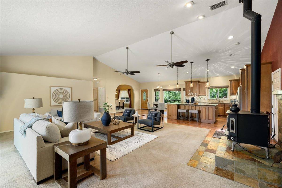Nestled on 9.3 acres, this 3 bed, 3 bath estate offers 3,672 sq ft of living space with gorgeous views, a built-in pool, owned solar, koi pond, hidden guest quarters, & lush landscaping! Through the front door you're immediately captivated by the grand living space and stunning views of the rolling hills beyond. The updated kitchen shines with granite countertops and a showstopping custom center island, ideal for entertaining. The dramatic light filled primary suite offers deck access, a laundry room, office, and flex space. While the ensuite bath features a sunken tub perfectly positioned to enjoy serene views, as well as a walk in closet for ample storage. Enjoy outdoor living from the back deck with built in BBQperfect for unwinding with a sunset glass of local wine. Or enjoy your morning coffee surrounded by butterflies and hummingbirds on the tranquil front deck. Energy efficient features include owned solar, dual-zone HVAC, automatic whole house generator, a high-producing well, and 1 acre-foot of PCWA ditch water. The property also includes a 1,100 sq ft non-conforming 3bed, 1bath apartment/ finished basement with private entrance ideal for guests, multi-gen living, or potential rental income. A rare retreat offering privacy, comfort, and incredible potential!