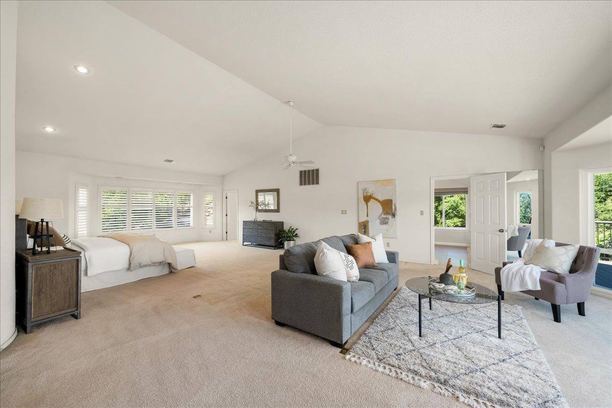Nestled on 9.3 acres, this 3 bed, 3 bath estate offers 3,672 sq ft of living space with gorgeous views, a built-in pool, owned solar, koi pond, hidden guest quarters, & lush landscaping! Through the front door you're immediately captivated by the grand living space and stunning views of the rolling hills beyond. The updated kitchen shines with granite countertops and a showstopping custom center island, ideal for entertaining. The dramatic light filled primary suite offers deck access, a laundry room, office, and flex space. While the ensuite bath features a sunken tub perfectly positioned to enjoy serene views, as well as a walk in closet for ample storage. Enjoy outdoor living from the back deck with built in BBQperfect for unwinding with a sunset glass of local wine. Or enjoy your morning coffee surrounded by butterflies and hummingbirds on the tranquil front deck. Energy efficient features include owned solar, dual-zone HVAC, automatic whole house generator, a high-producing well, and 1 acre-foot of PCWA ditch water. The property also includes a 1,100 sq ft non-conforming 3bed, 1bath apartment/ finished basement with private entrance ideal for guests, multi-gen living, or potential rental income. A rare retreat offering privacy, comfort, and incredible potential!