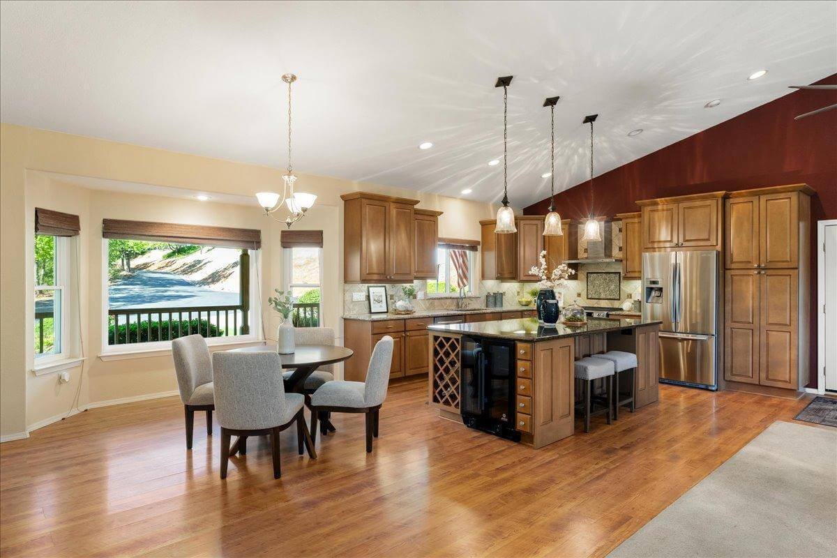 Nestled on 9.3 acres, this 3 bed, 3 bath estate offers 3,672 sq ft of living space with gorgeous views, a built-in pool, owned solar, koi pond, hidden guest quarters, & lush landscaping! Through the front door you're immediately captivated by the grand living space and stunning views of the rolling hills beyond. The updated kitchen shines with granite countertops and a showstopping custom center island, ideal for entertaining. The dramatic light filled primary suite offers deck access, a laundry room, office, and flex space. While the ensuite bath features a sunken tub perfectly positioned to enjoy serene views, as well as a walk in closet for ample storage. Enjoy outdoor living from the back deck with built in BBQperfect for unwinding with a sunset glass of local wine. Or enjoy your morning coffee surrounded by butterflies and hummingbirds on the tranquil front deck. Energy efficient features include owned solar, dual-zone HVAC, automatic whole house generator, a high-producing well, and 1 acre-foot of PCWA ditch water. The property also includes a 1,100 sq ft non-conforming 3bed, 1bath apartment/ finished basement with private entrance ideal for guests, multi-gen living, or potential rental income. A rare retreat offering privacy, comfort, and incredible potential!